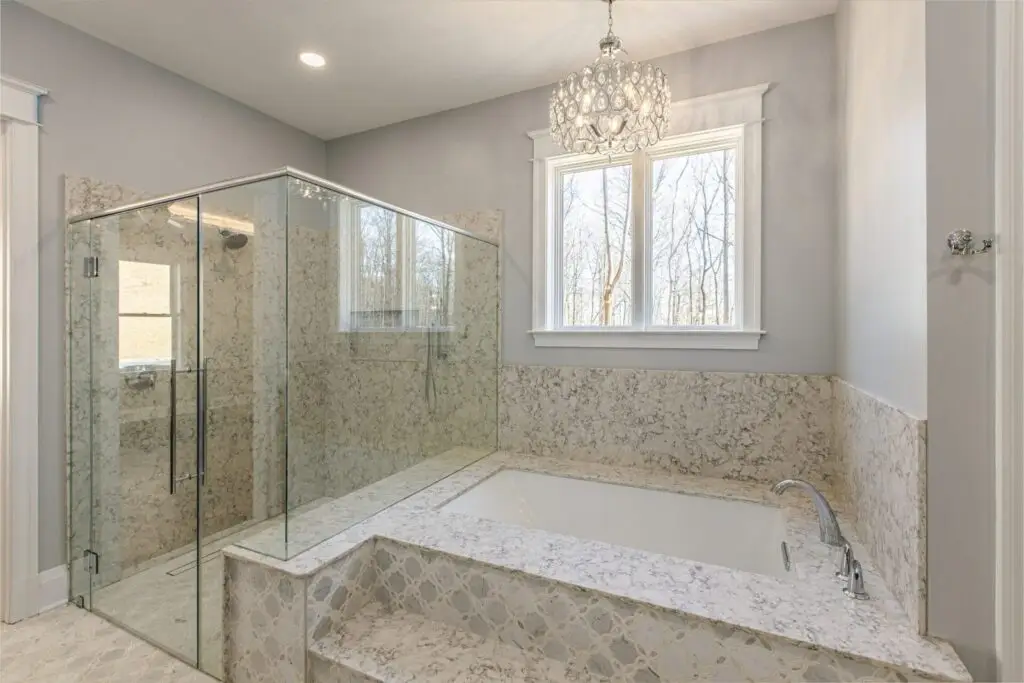 Custom frameless glass shower enclosure with seamless design and elegant hardware