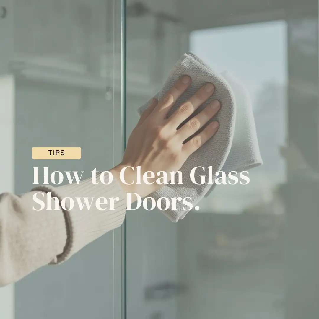 Glass shower door being cleaned, showing a clear and streak free surface after removing water spots and buildup.