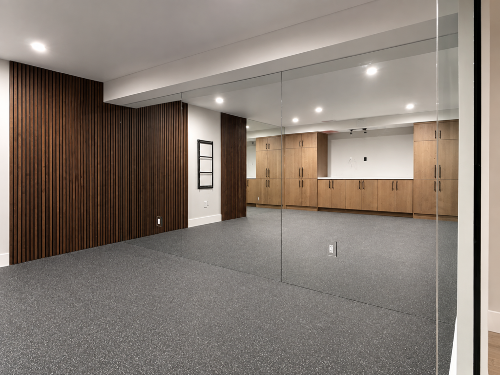 Open room divided by a full-height glass partition wall